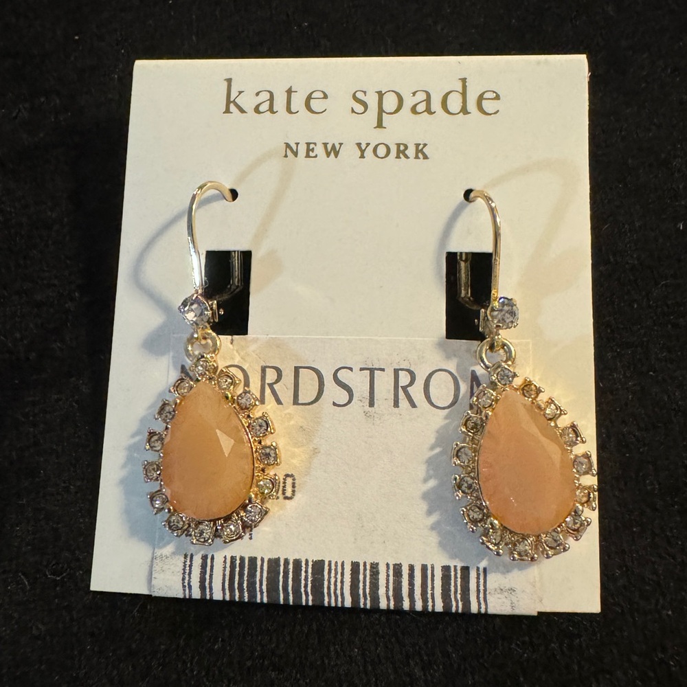 Teardrop pink stones surrounded by faux diamond halo